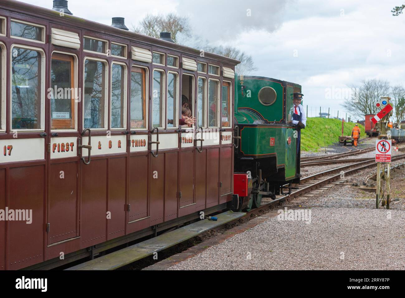 Steam locomotive 'Axe' pulling a train out of Woody Bay station on the Lynton and Barnstaple Railway, Devon, UK. Stock Photo