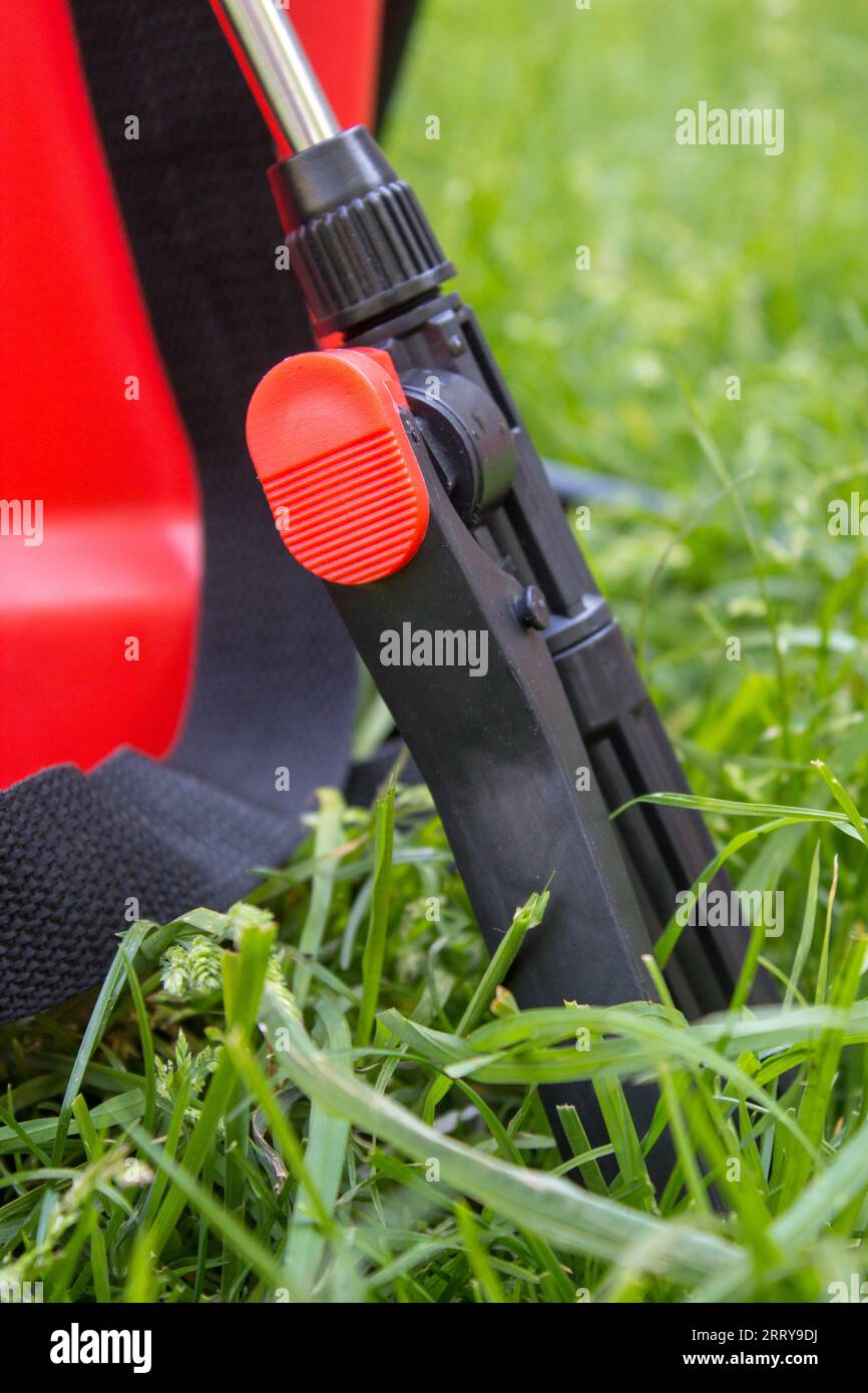 closeup handle garden sprayers for agriculture on the grass Stock Photo
