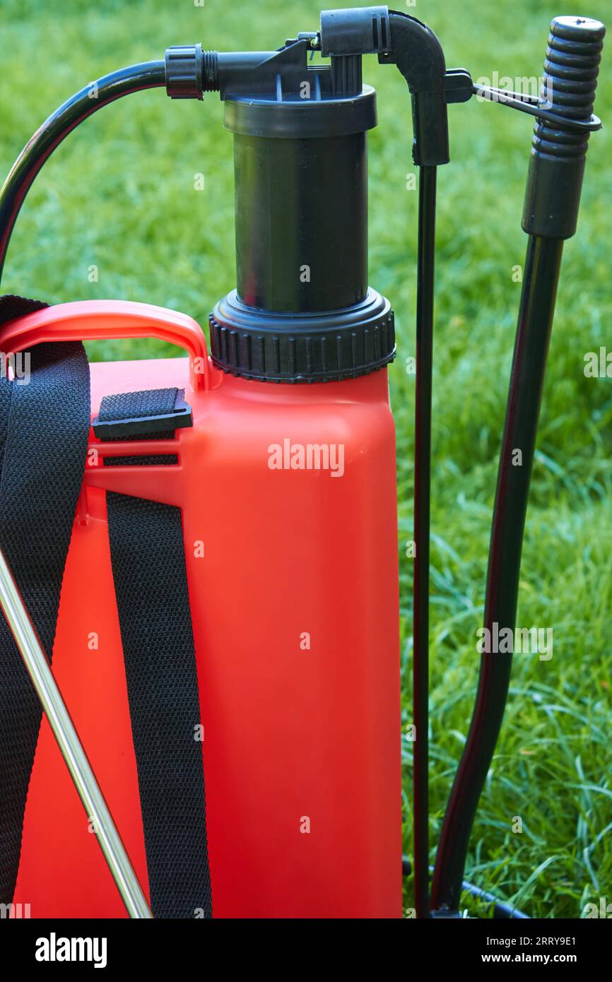 sprayer with hand pump close up on grass Stock Photo