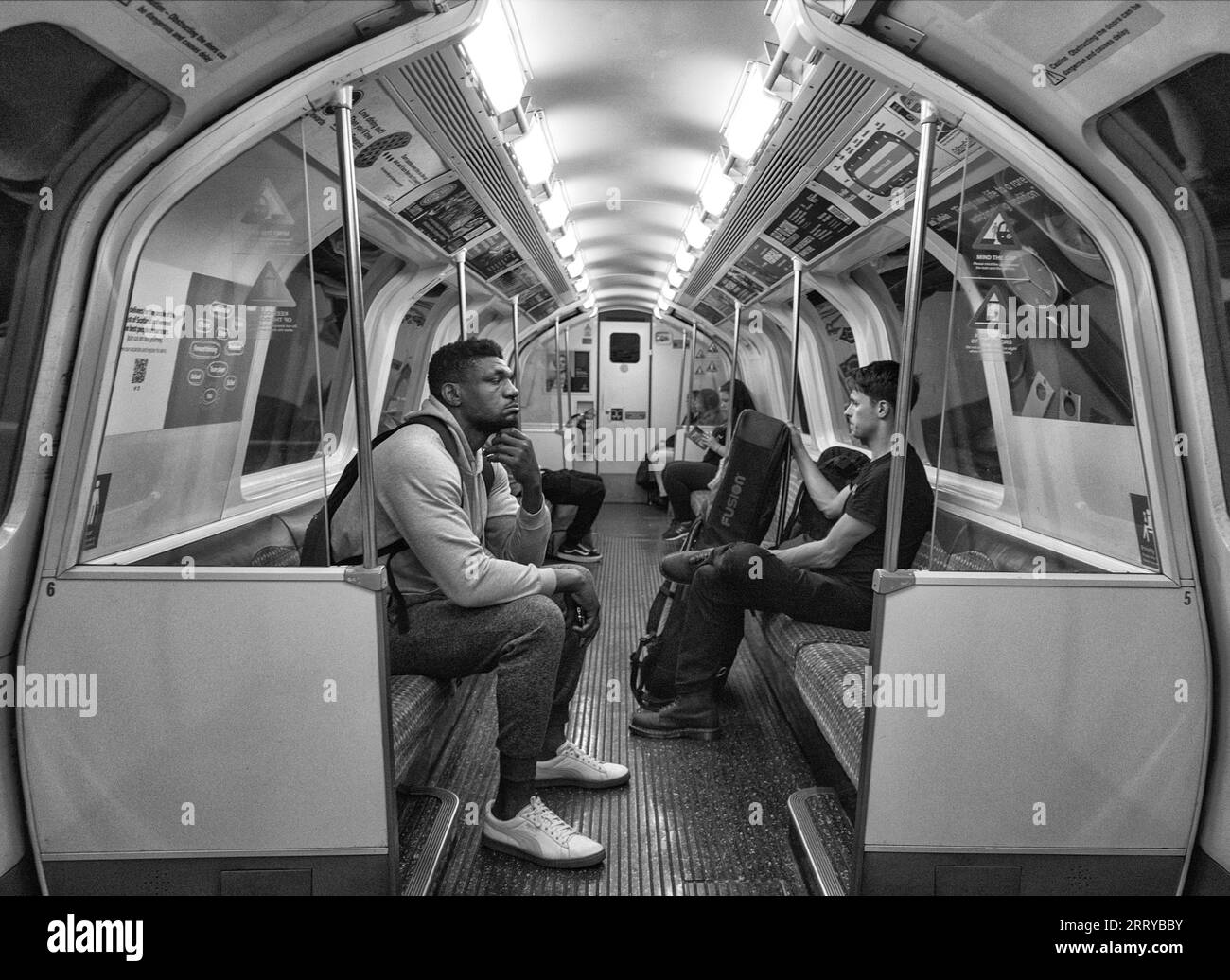 Passengers on the Glasgow SPT subway showing the longitudinal seating Stock Photo