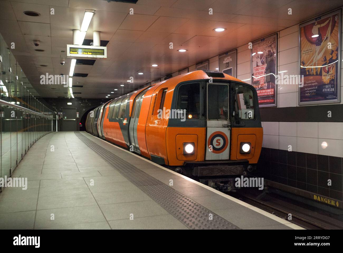 SPT subway train arriving at Glasgow Ibrox underground station on the Glasgow underground / subway Stock Photo