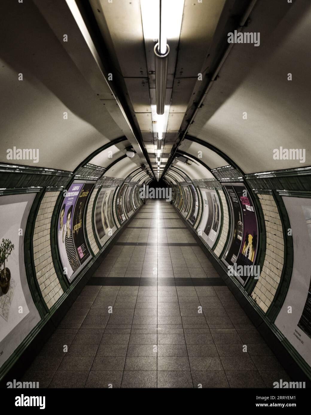 Empty, dark and scary interconnecting tunnel passageway near the Northern line tube at Embankment underground station. Stock Photo