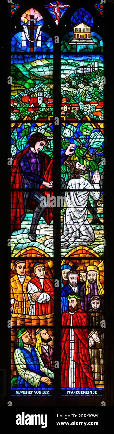 Stained-glass window depicting Jesus on the Mount of Olives and condemnation by Pontius Pilate. Votivkirche – Votive Church, Vienna, Austria. Stock Photo