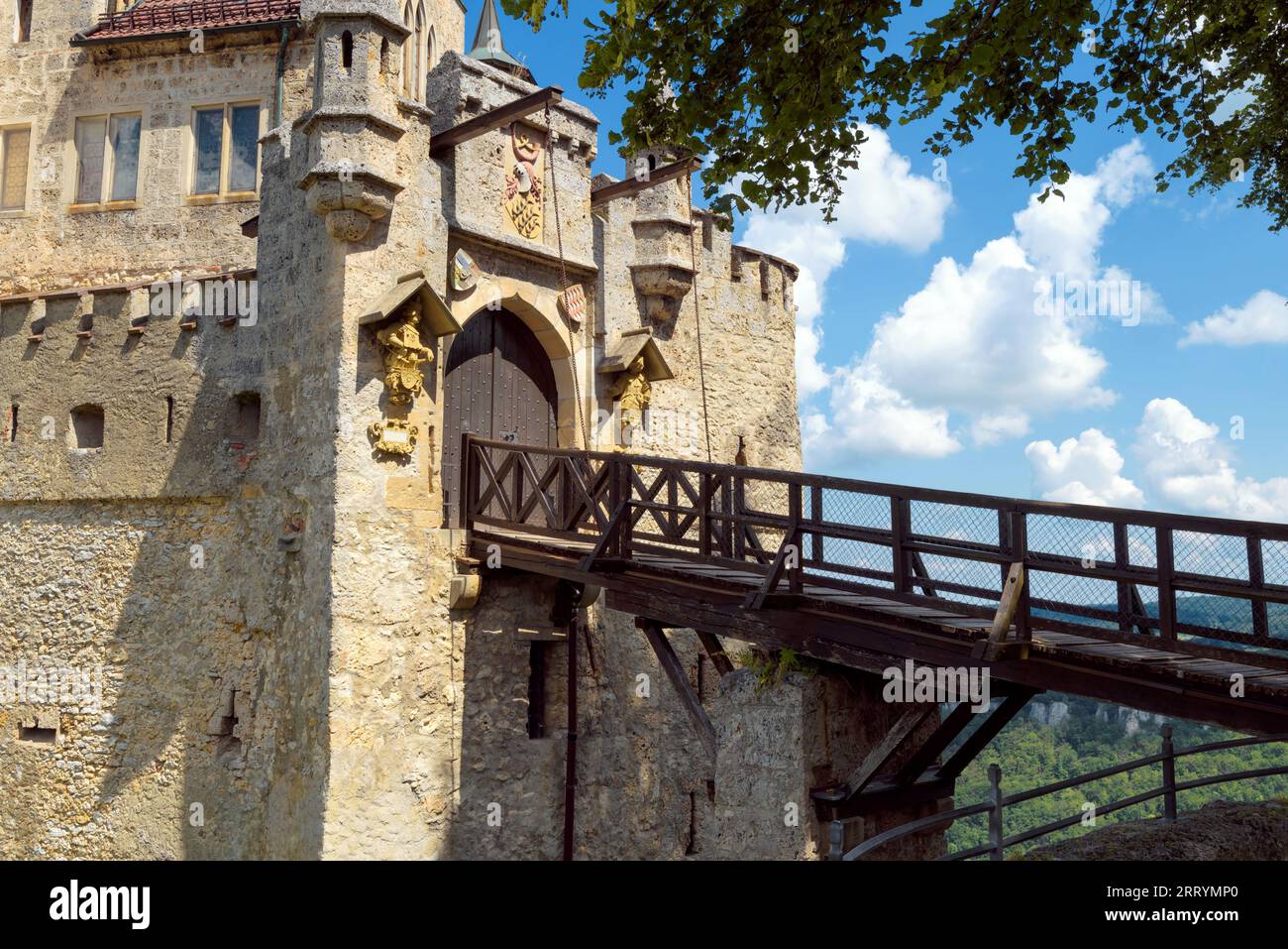 Lichtenstein Castle gates with old wooden bridge in summer, Germany, Europe. This famous castle is landmark of Schwarzwald. Gothic castle entrance aga Stock Photo