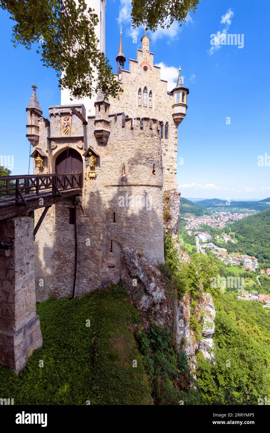 Lichtenstein Castle on mountain top with old wooden bridge, Germany, Europe. This famous castle is landmark of Schwarzwald. Vertical view of Gothic ca Stock Photo
