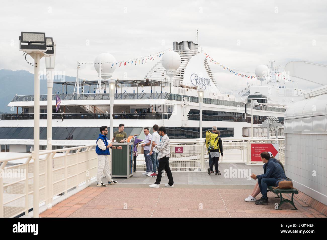 Tourists around the Vancouver cruise ship docks at Canada Place and the Vancouver Convention Centre.  Vancouver BC, Canada. Stock Photo
