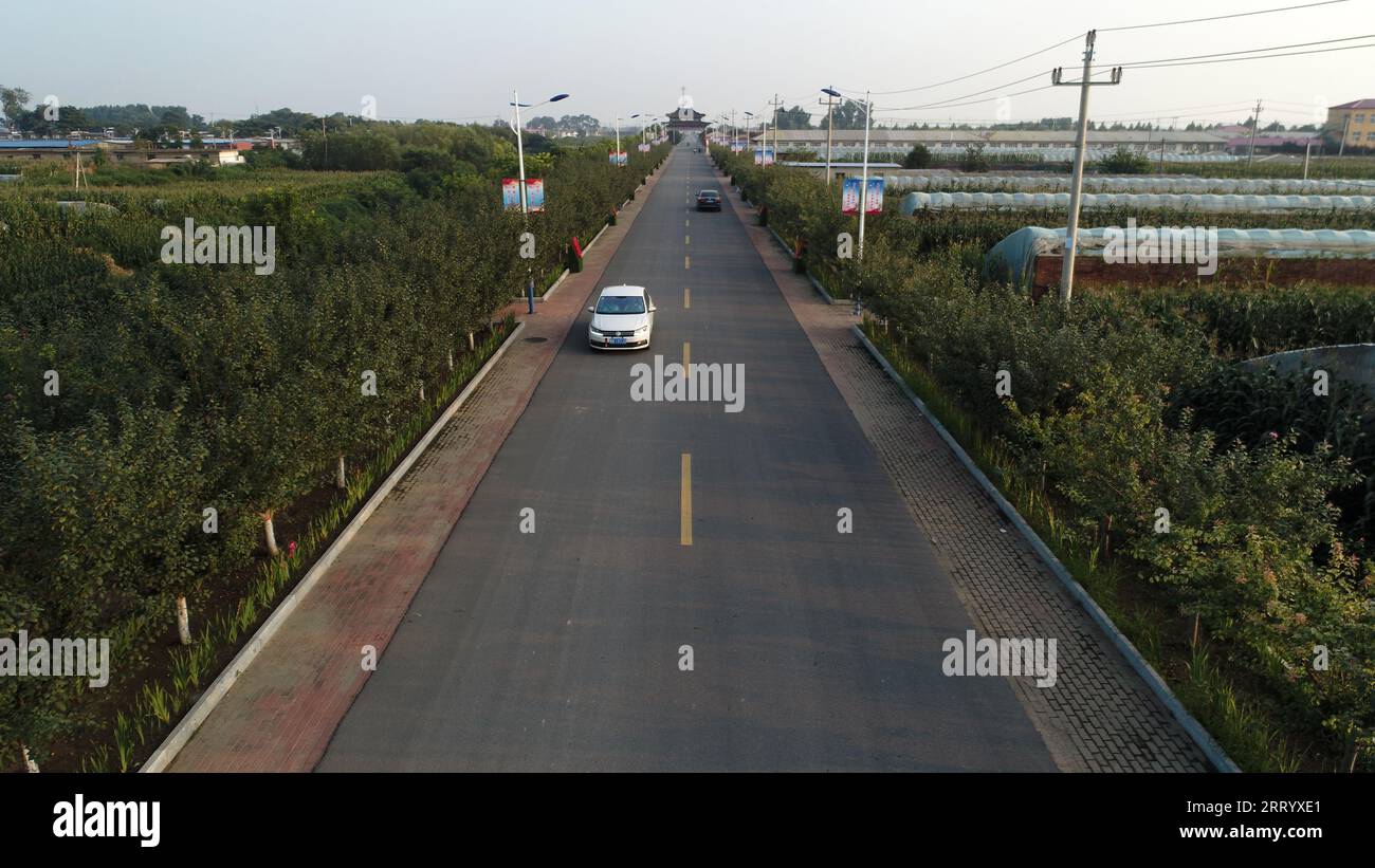 Vehicles In Rural Community Vehicles and pedestrians on rural roads, North China Stock Photo - Alamy
