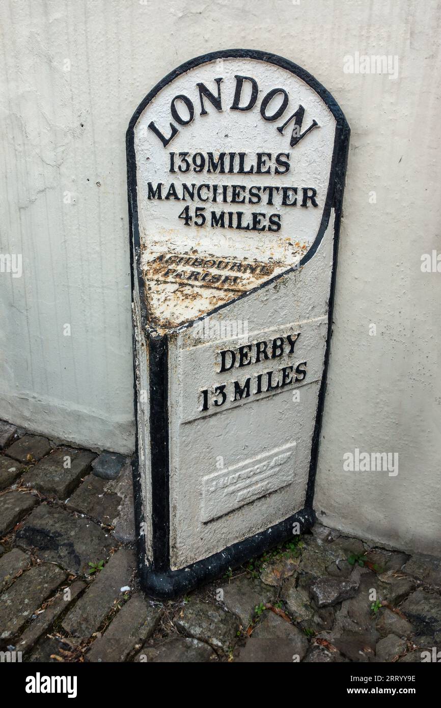 Old,Cast Iron,Mileage Sign,Ashbourne,Derbyshire,England,London,Derby,Manchester Stock Photo
