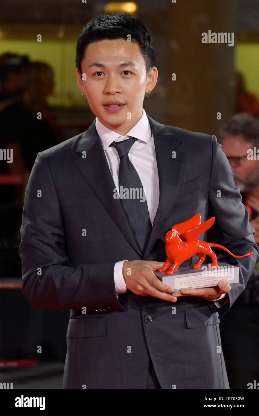 Venice Lido, Italy. 09th Sep, 2023. Lee Hong-Chi poses with the Lion of the Future - Luigi De Laurentiis Award for a Debut Film for film 'Love Is A Gun' at the winner's photocall at the 80th Venice International Film Festival. Credit: SOPA Images Limited/Alamy Live News Stock Photo