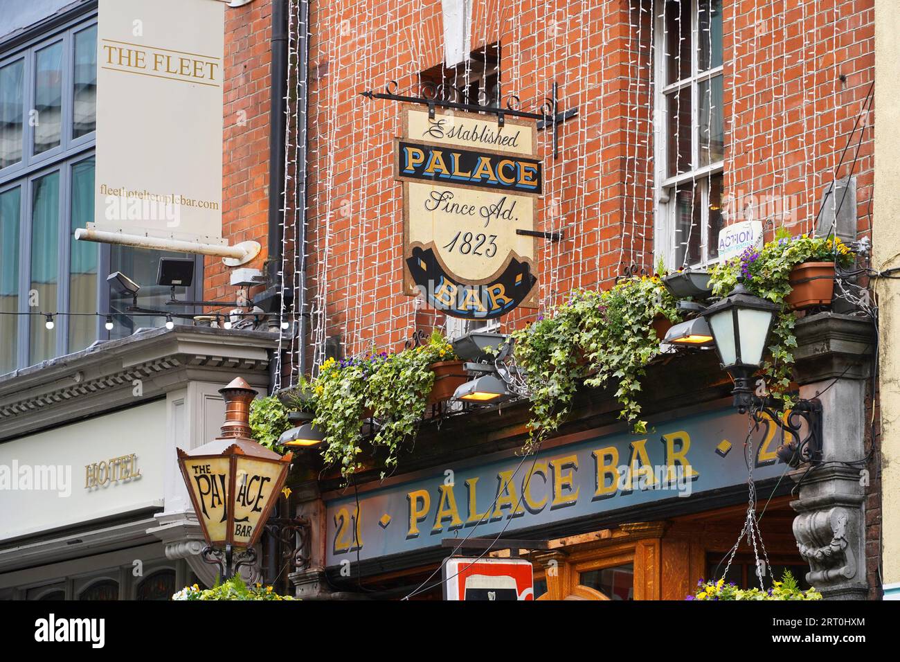 Outdoor signs on building wall for bar and hotel in Temple Bar area of Dublin, Ireland Stock