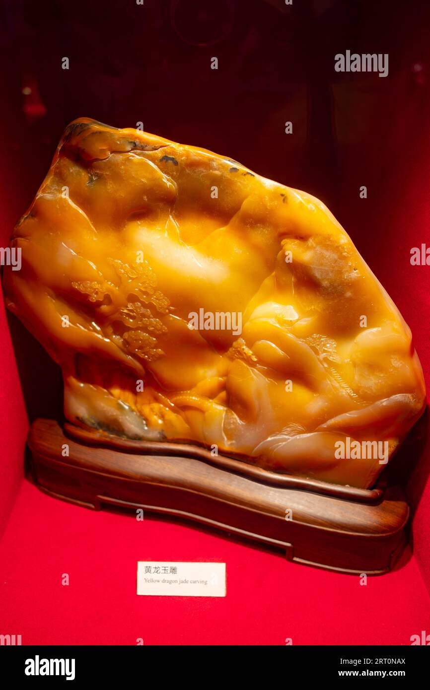 GuangZhou GuangDong ChinaJuly 18 2023yellow dragon jade carving in