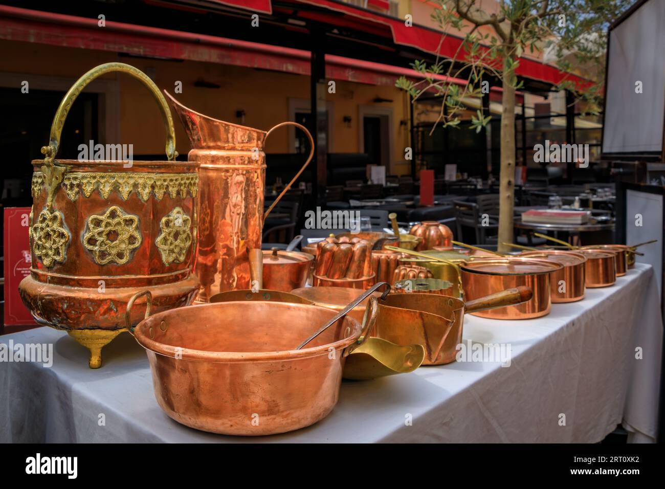 Vintage copper cookware pots and pans for sale at the Cours Saleya outdoor flea market in Old Town Vieille Ville, Nice, French Riviera South of France Stock Photo
