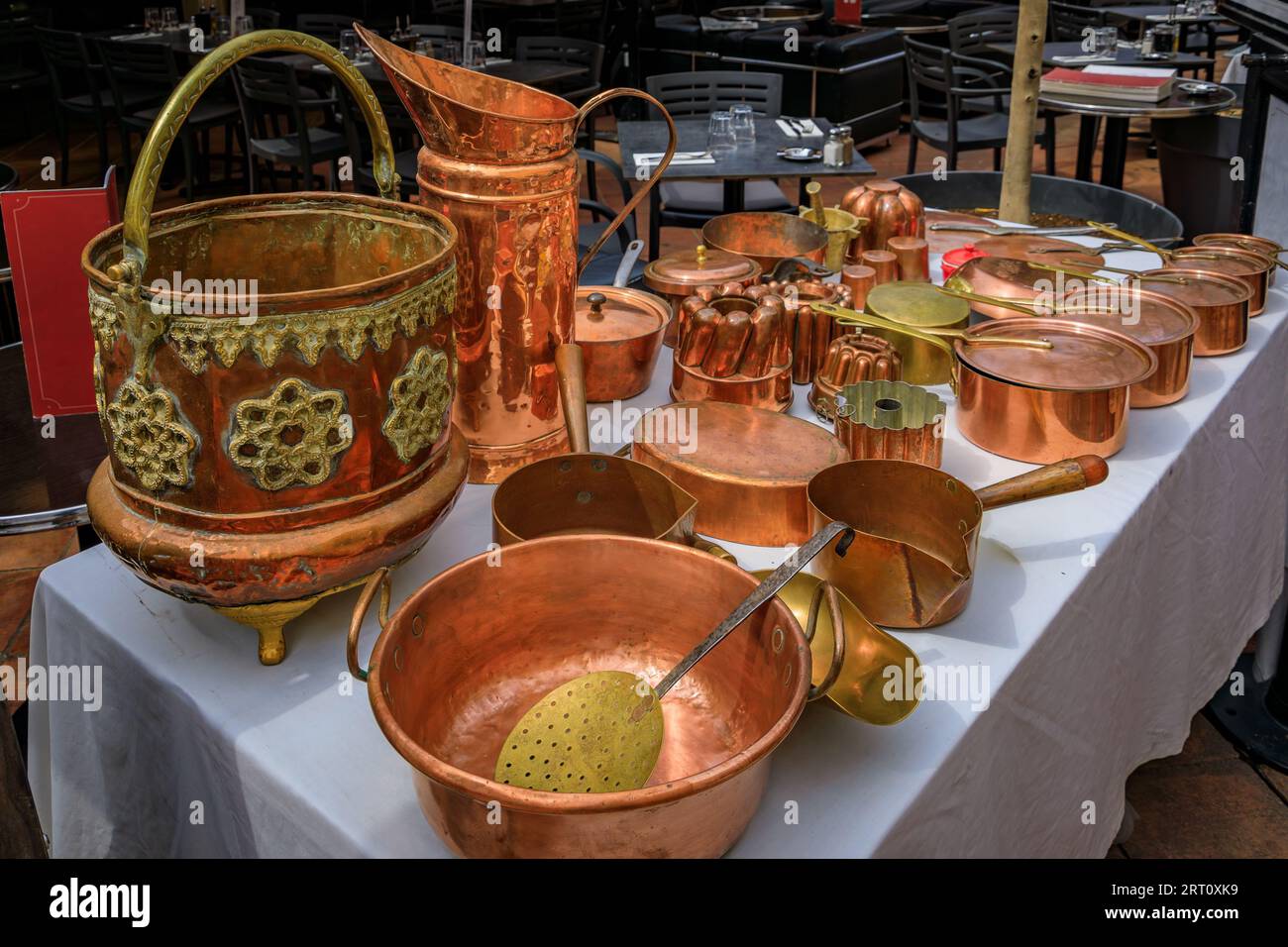 Vintage copper cookware pots and pans for sale at the Cours Saleya outdoor flea market in Old Town Vieille Ville, Nice, French Riviera South of France Stock Photo