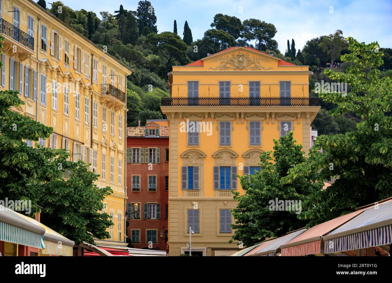 Ornate Mediterranean house facades at the Cours Saleya outdoor farmers market in Old Town Vieille Ville in Nice, French Riviera South of France Stock Photo