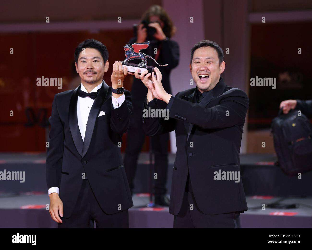 Venice, Italy. 9th Sep, 2023. Director Ryusuke Hamaguchi (R) and actor Hitoshi Omika pose with the Silver Lion Grand Jury Prize for 'Evil Does Not Exist' during the 80th Venice International Film Festival in Venice, Italy, on Sept. 9, 2023. This year's Venice Film Festival ran from Aug. 30 to Sept. 9 at the Venice Lido island, with 23 films presented in the main competition for the Golden Lion. Credit: Jin Mamengni/Xinhua/Alamy Live News Stock Photo