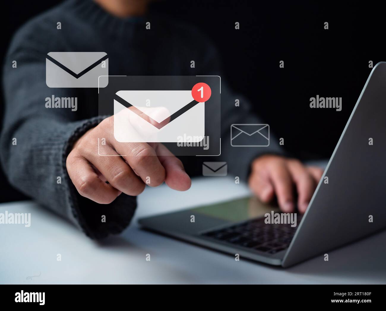 Human hand touching email on virtual screen. New email notification concept for business email communication and digital marketing. The inbox receives Stock Photo