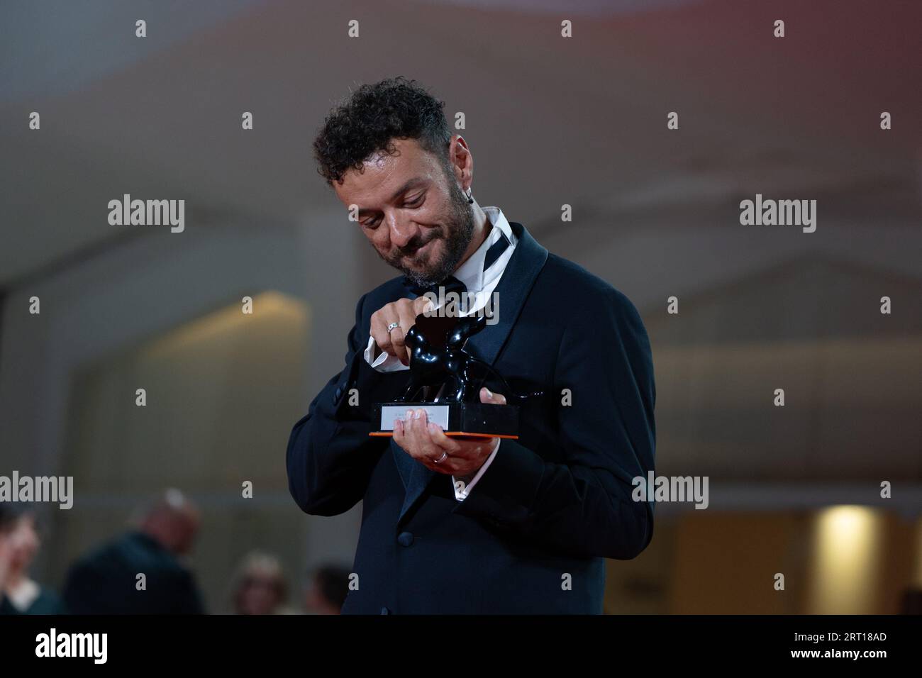 Venice, Italy. 09th Sep, 2023. VENICE, ITALY - SEPTEMBER 09: Enrico Maria Artale poses with the Best Screenplay Award for film 'El Paraiso' and the award for Best Actress for film 'El Paraiso' at the winner's photocall at the 80th Venice International Film Festival on September 09, 2023 in Venice, Italy. (Photo by Luca Carlino/NurPhoto) Credit: NurPhoto SRL/Alamy Live News Stock Photo