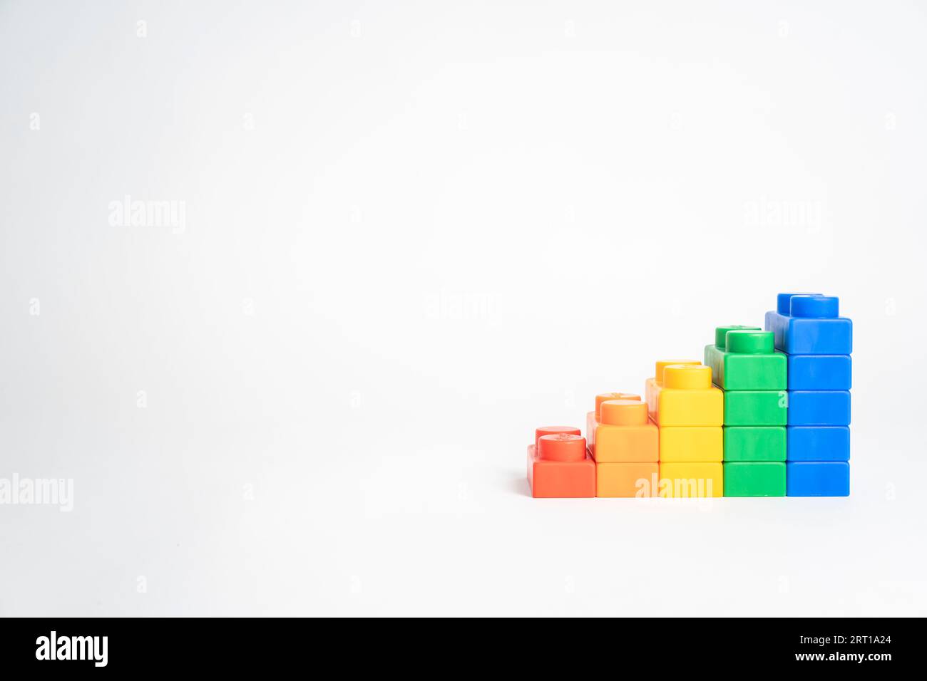 Kid hand put the colorful plastic building block toy Stock Photo - Alamy