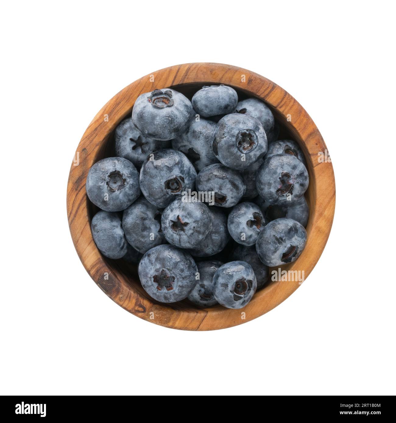 Fresh washed organic blueberries ina olive wood bowl topv view isolated on white background Stock Photo