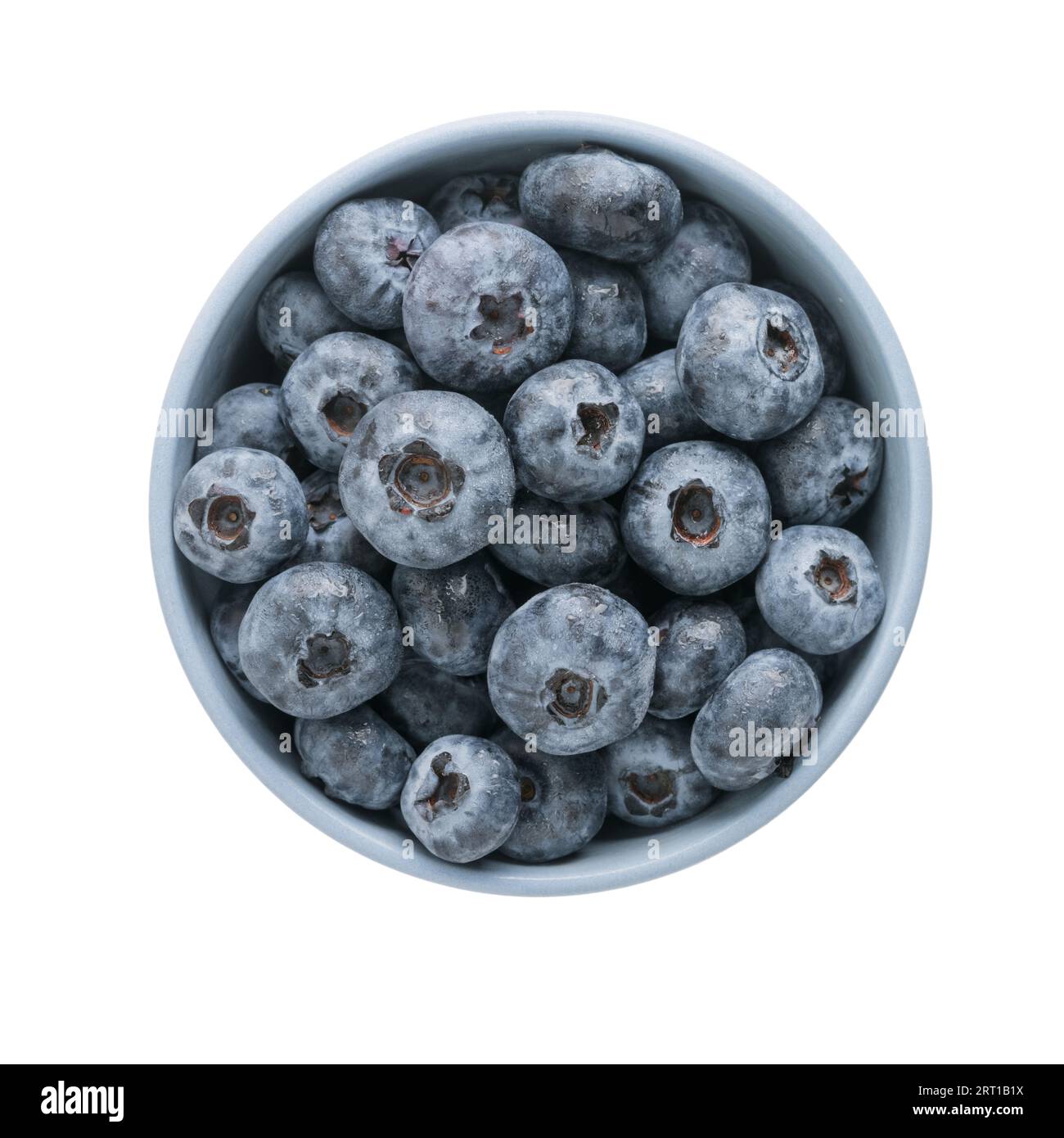 Fresh washed organic blueberries ina blue ceramic bowl topv view isolated on white background Stock Photo