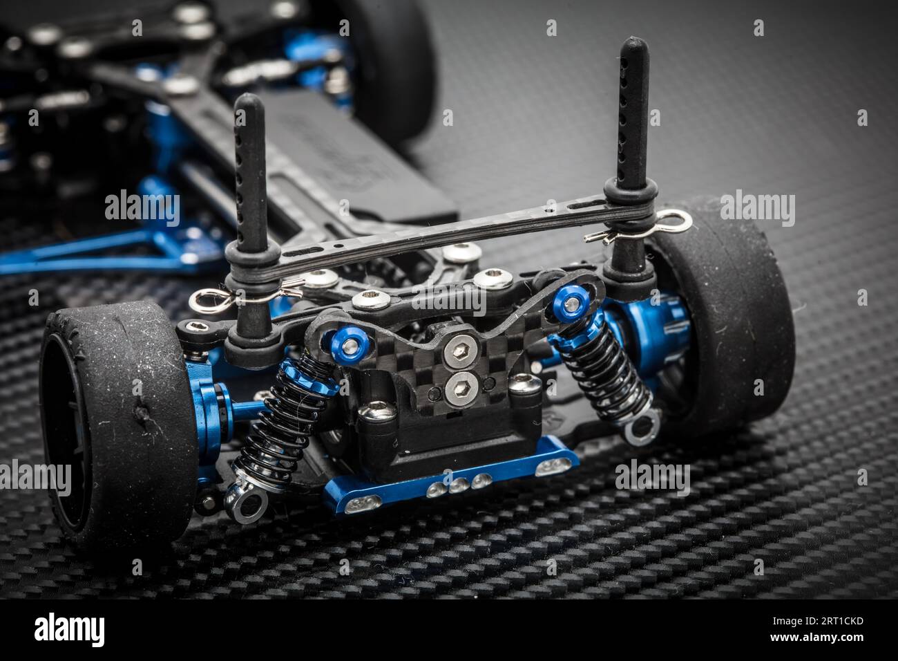 RC car chassis and parts being assembled to form a radio controlled