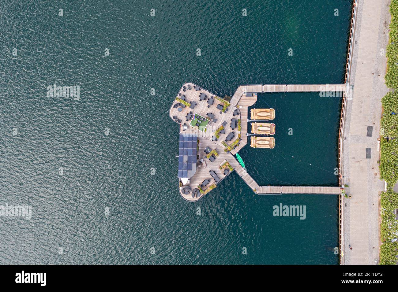 Copenhagen, Denmark, August 20, 2021: Aerial drone view of Green Island CPH, a floating cafe bar in the harbour Stock Photo