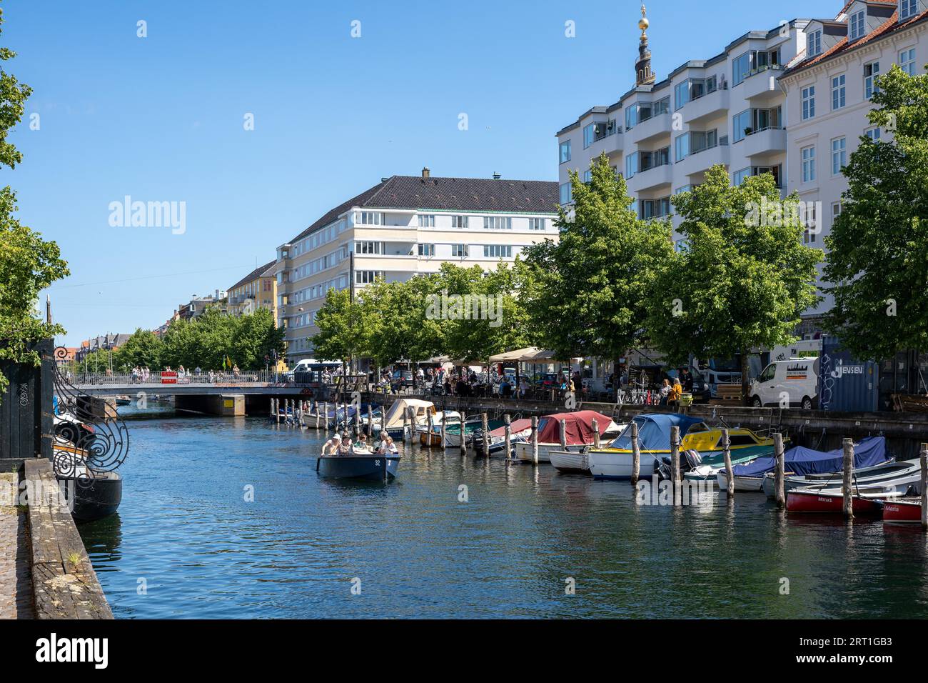 Copenhagen, Denmark, July 12, 2022: A canal and boats in Christianshavn district in the historic city centre Stock Photo