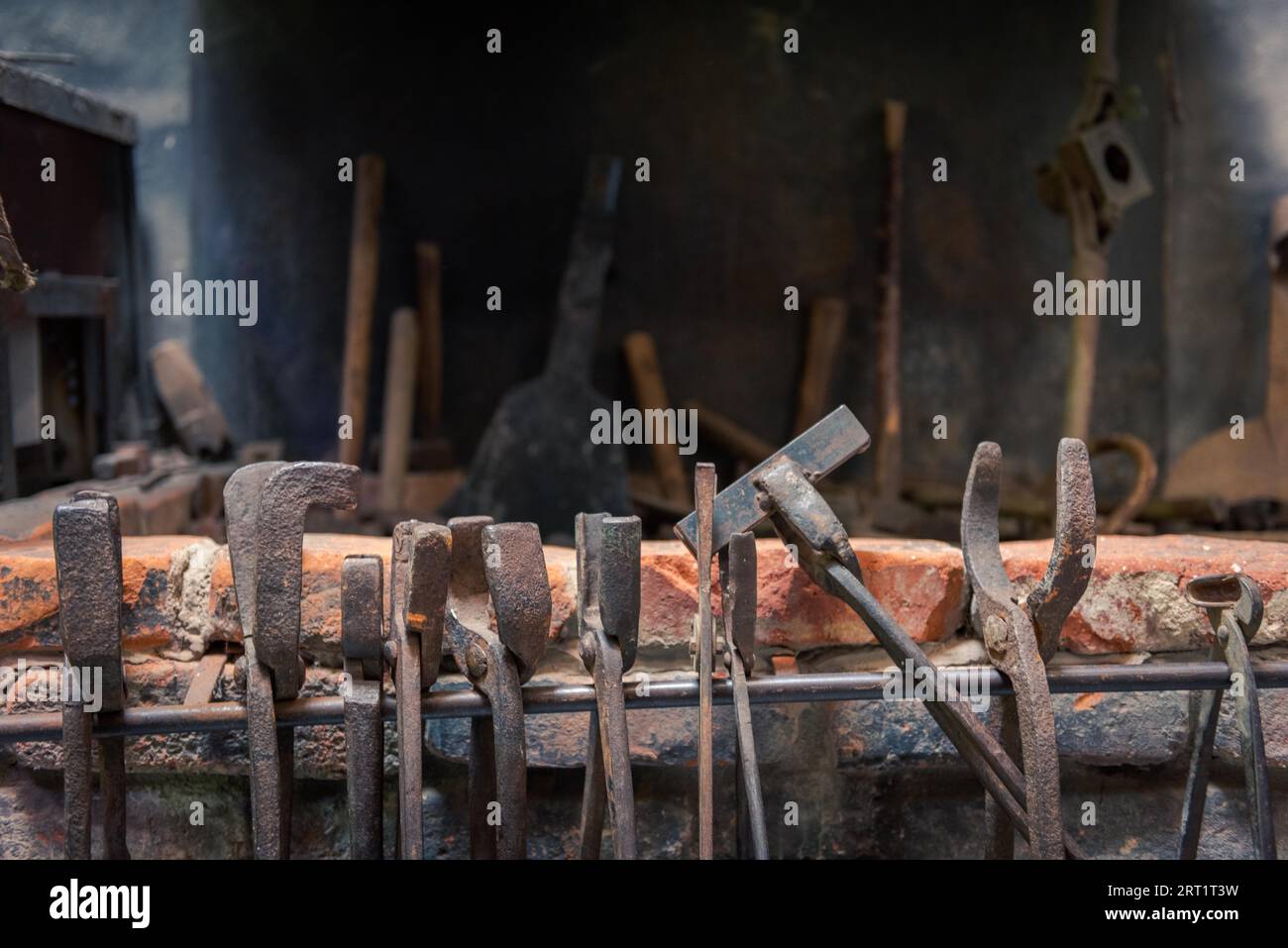 Blacksmith Tongs Tool Hanged In Forge Stock Photo - Download Image