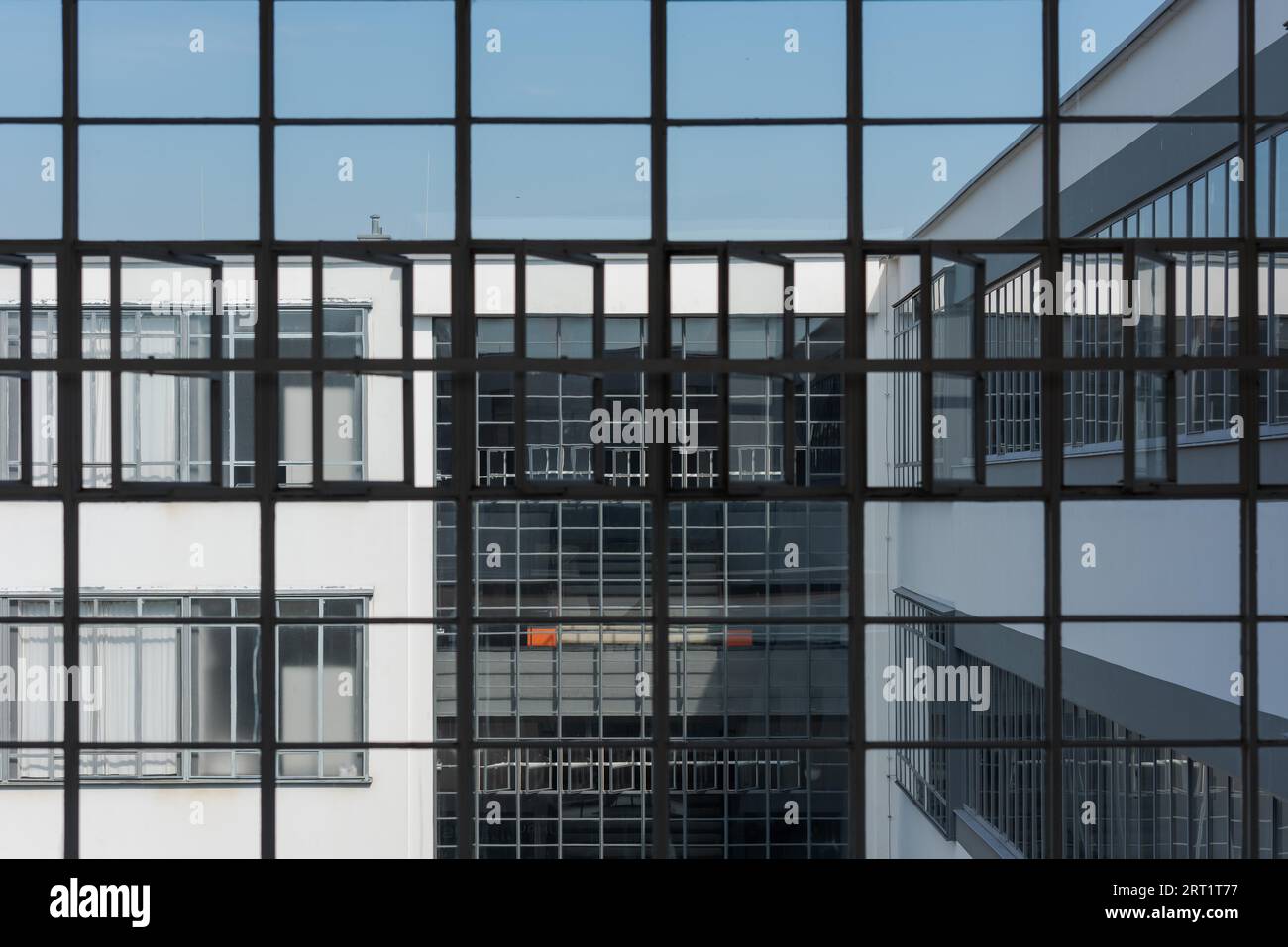 Big window front with partially opened windows of the Bauhaus in Dessau on clear day Stock Photo