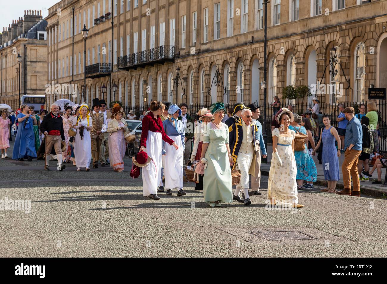 Jane Austen Festival 2023. The Grand Regency Promenade where people from around the world join the official opening procession of the festival.Bath Stock Photo