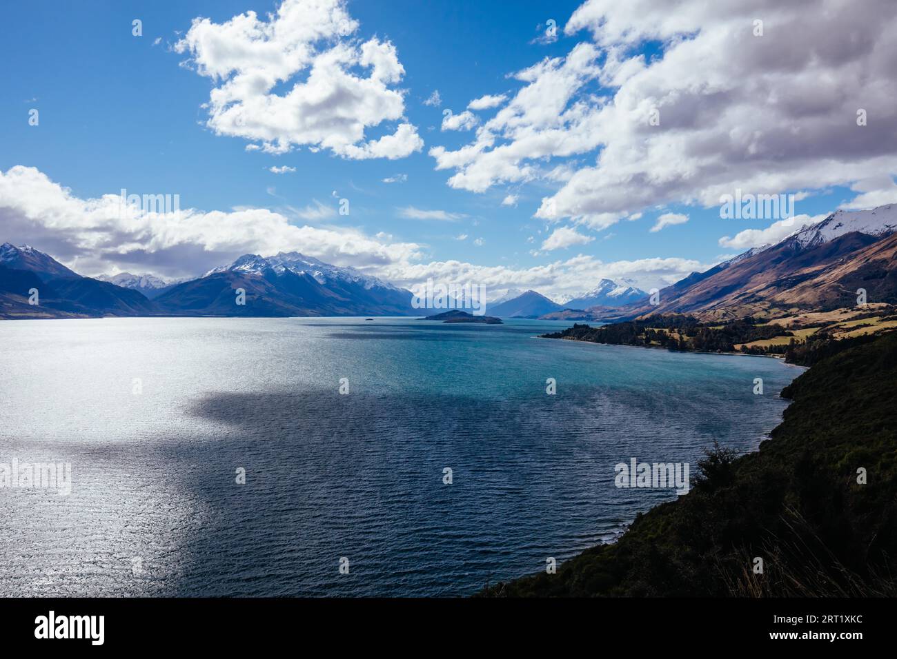 Lake Wakatipu and surrounding mountains from Bennetts Bluff Lookout, on a sunny spring day near Glenorchy in New Zealand Stock Photo