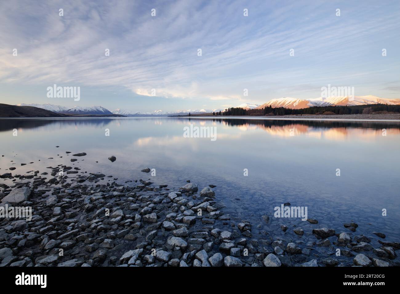 Majestic Lake Tekapo at sunset on a cool spring evening in New Zealand ...