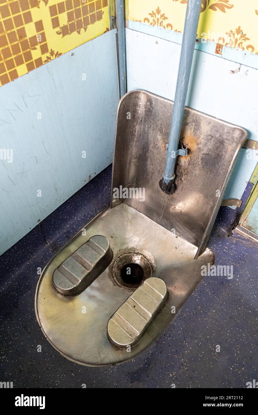 Jodhpur, India, December 8, 2019: An Indian style toilet on an Indian train Stock Photo