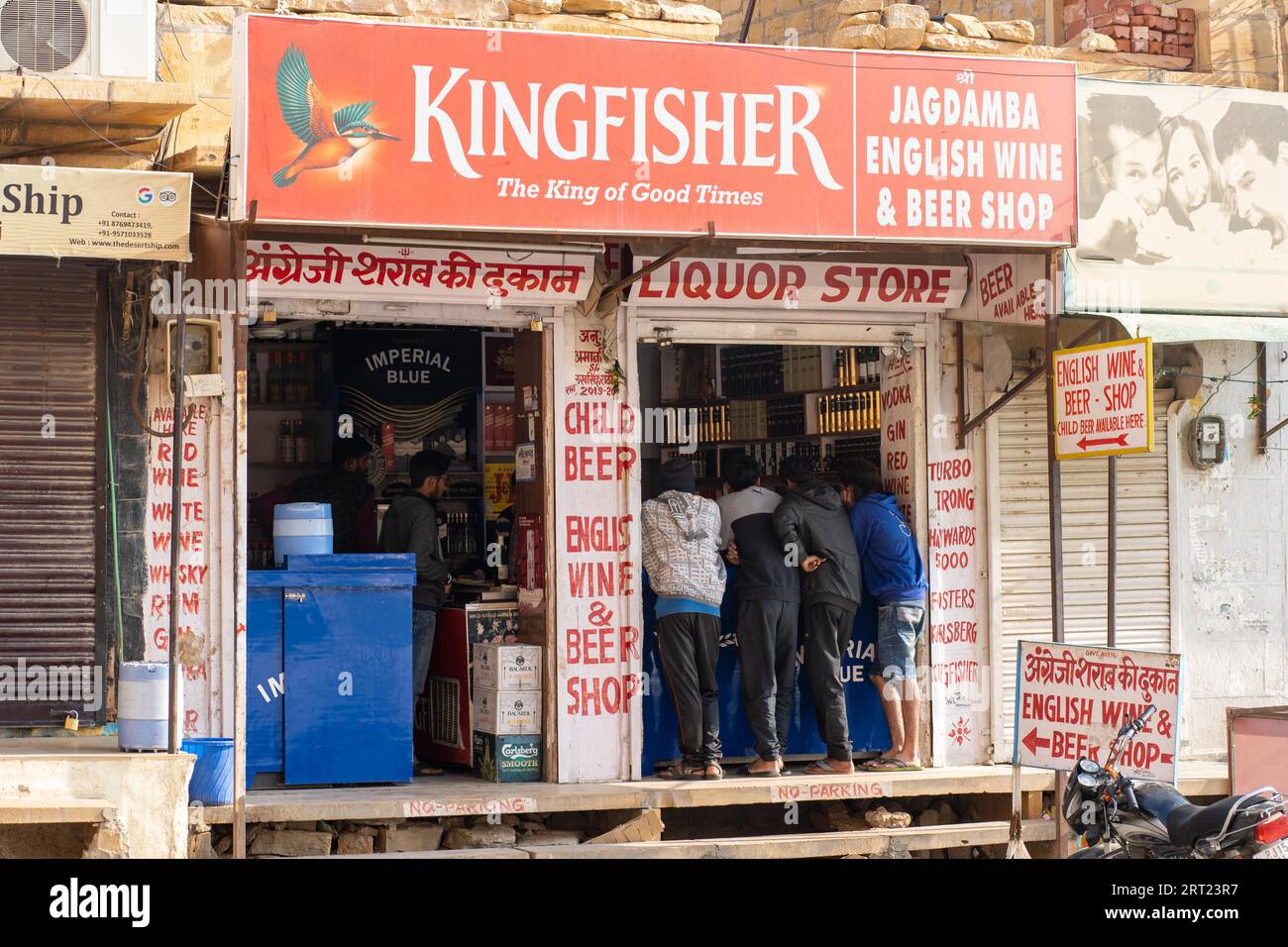 Jaisalmer, India, December 6, 2019: People standing at the counter of a liquor store Stock Photo