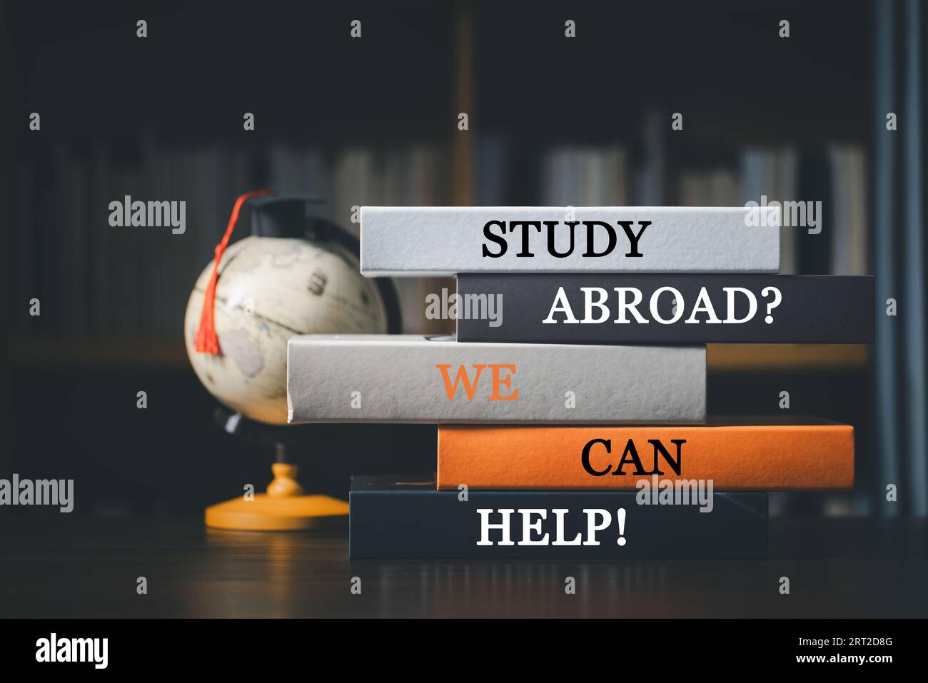 Books with words 'Study Abroad? We Can Help! Concept of global business study, abroad educational, Back to School. Education in Global world, Study ab Stock Photo