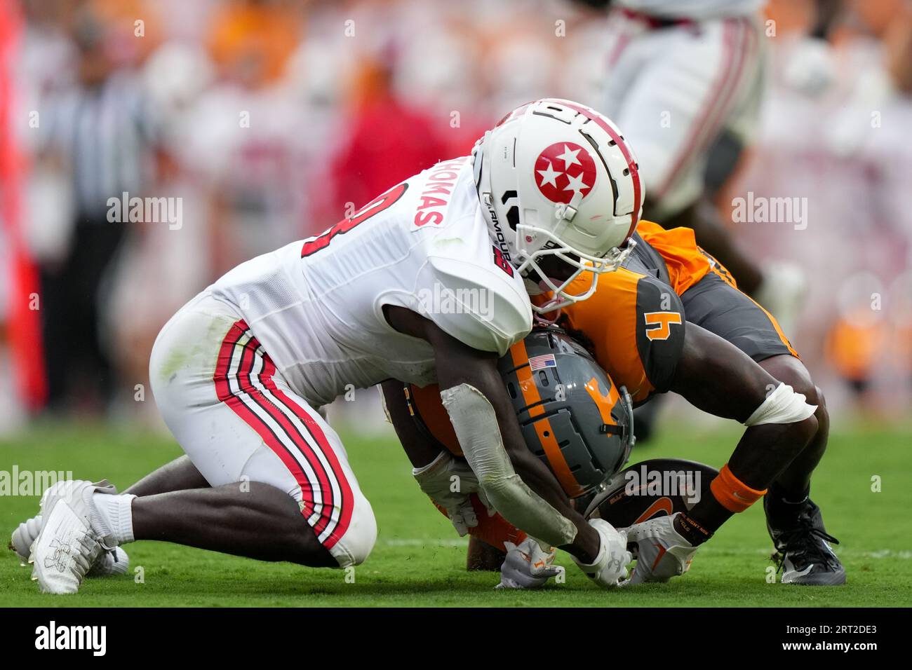 November 13, 2021: Cedric Tillman #4 of the Tennessee Volunteers runs with  the ball after a catch and is tackled by Derion Kendrick #11 of the Georgia  Bulldogs during the NCAA football