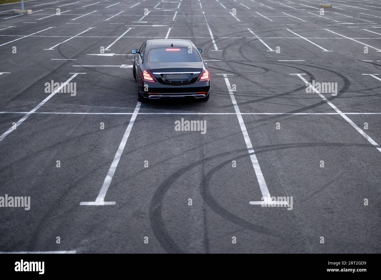 Luxury black car on a parking lot Stock Photo - Alamy