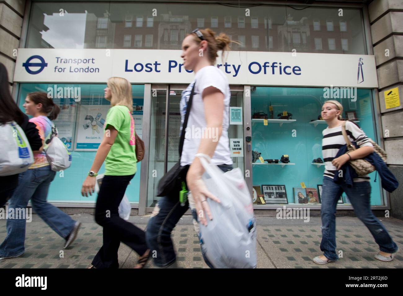Pedestrians walk past the Transport for London (TfL) Lost Property Office at its former long-term location on Baker Street, Marylebone, in 2011. Established at this site in 1933, the office served as the central clearinghouse for hundreds of thousands of items found annually across the London Underground, buses, and taxis. In 2011, the facility was a well-known London landmark, famously housing everything from thousands of umbrellas and mobile phones to more unusual lost property like sets of dentures or musical instruments Stock Photo