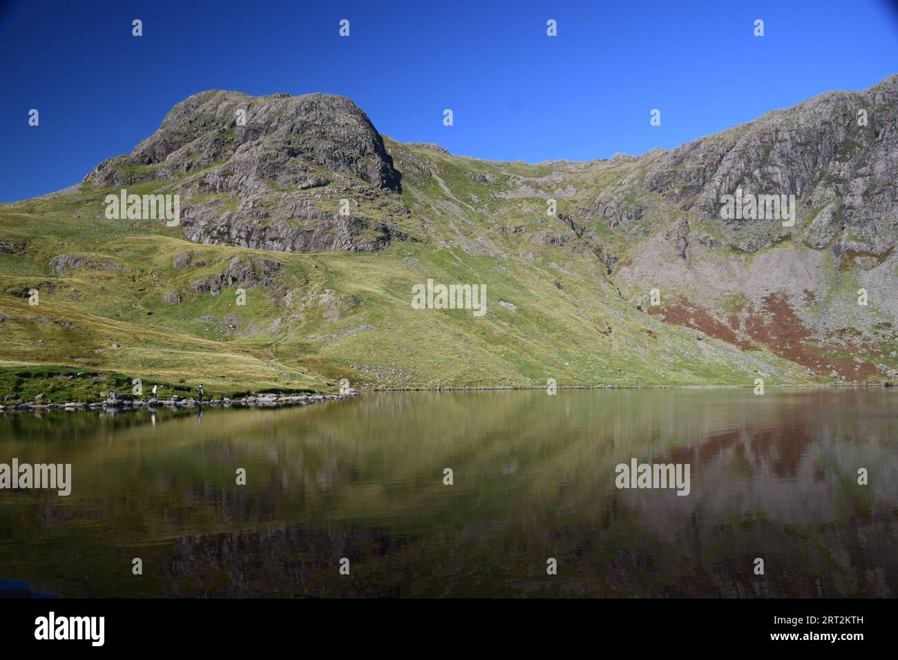 Stickle tarn a beautiful glacial tarn high up in the Langdales of the Lake District. Stock Photo