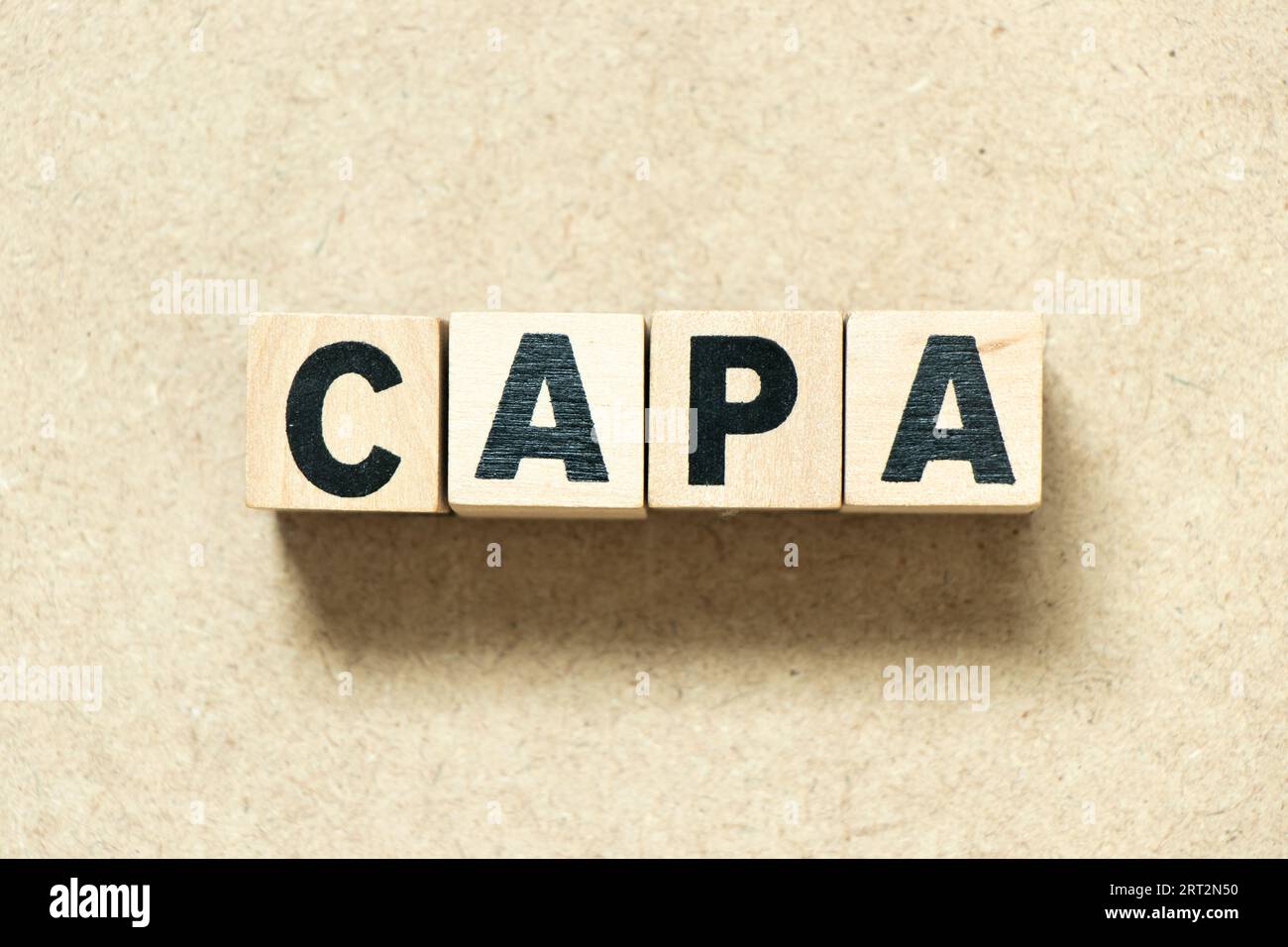 Alphabet letter block in word CAPA (abbreviation of corrective action and preventive action) on wood background Stock Photo