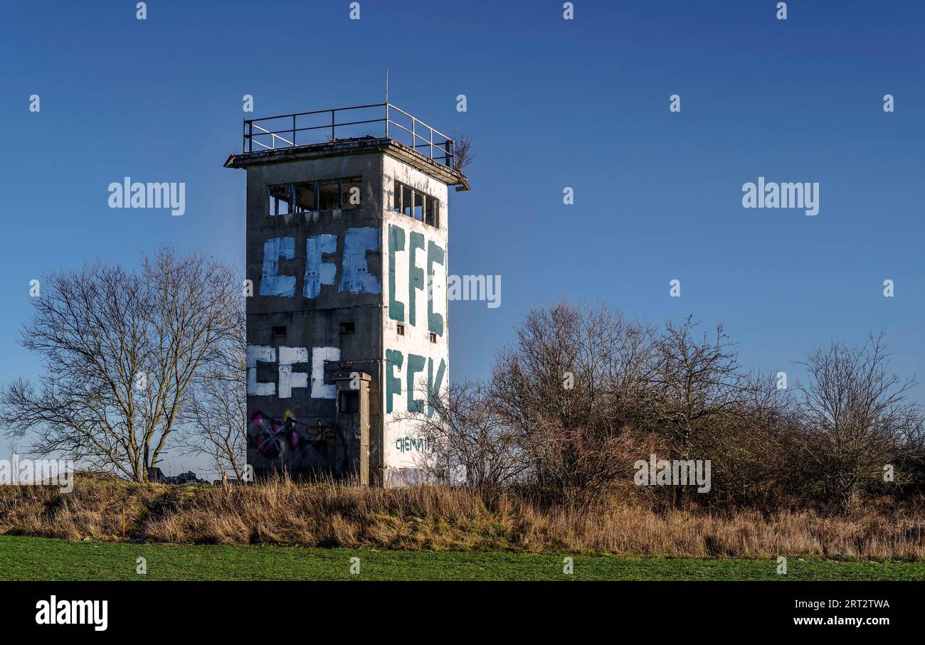 An observation tower was a watchtower of the GDR border troops. It consisted of concrete elements and could be entered through a steel door. The Stock Photo