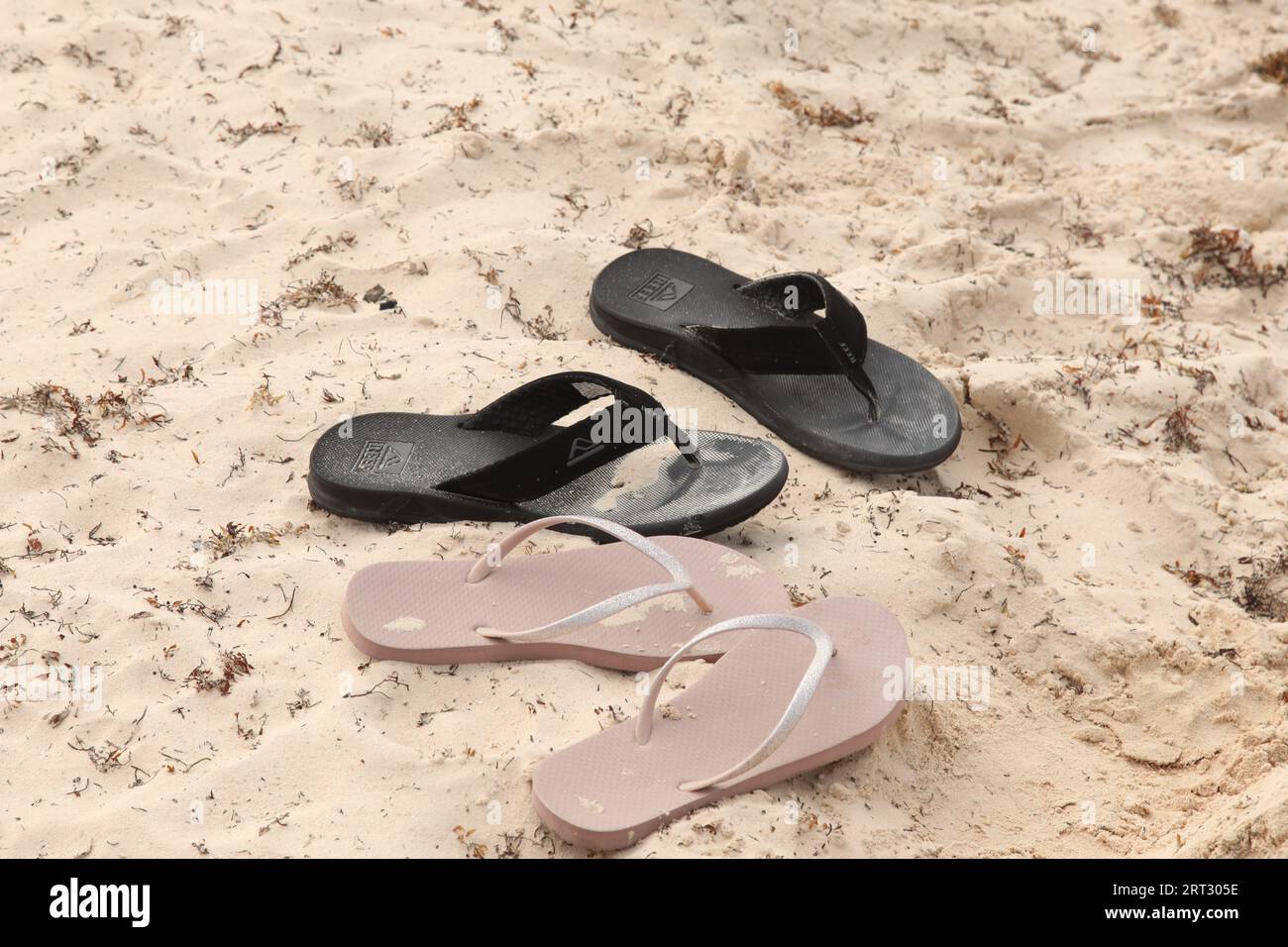 Flip flops on the sand on a Caribbean beach, Dominican Republic, Punta Cana 2023 Stock Photo