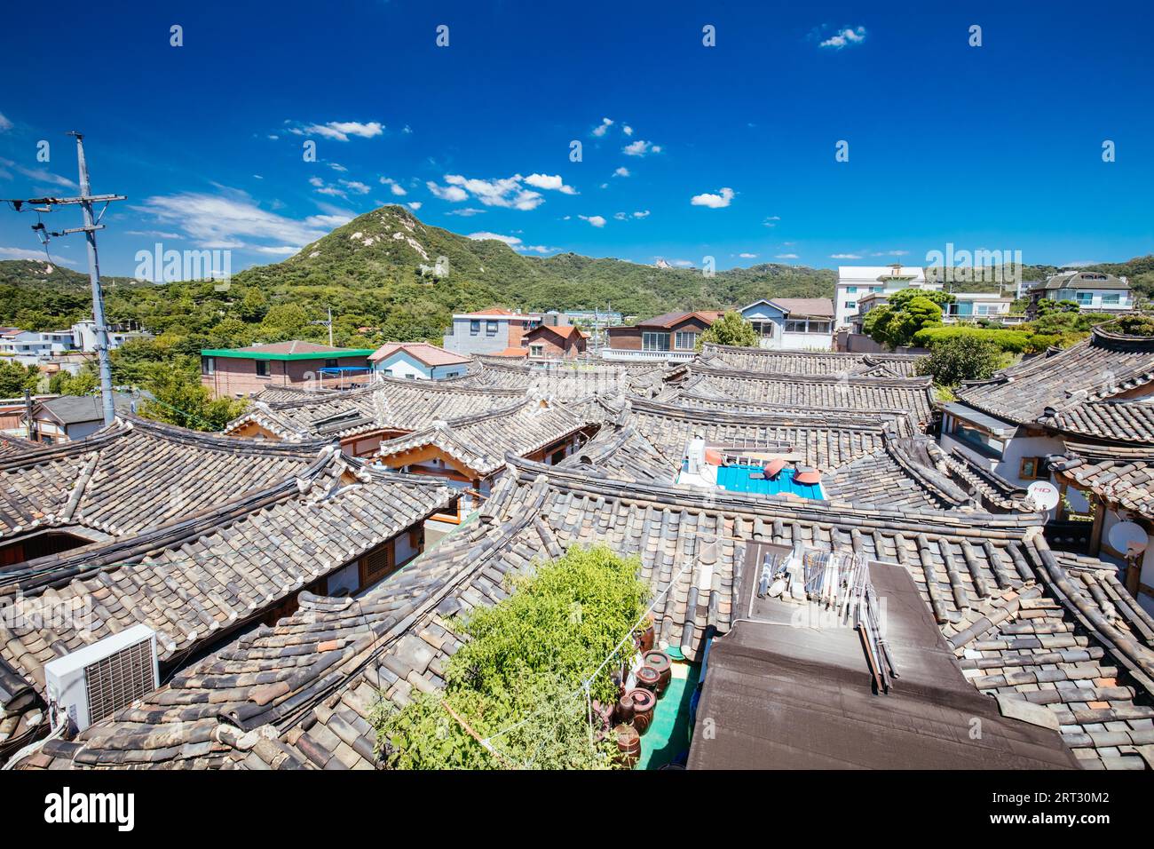A view across rooftops in Bukchon Hanok Village. This area is a Korean ...