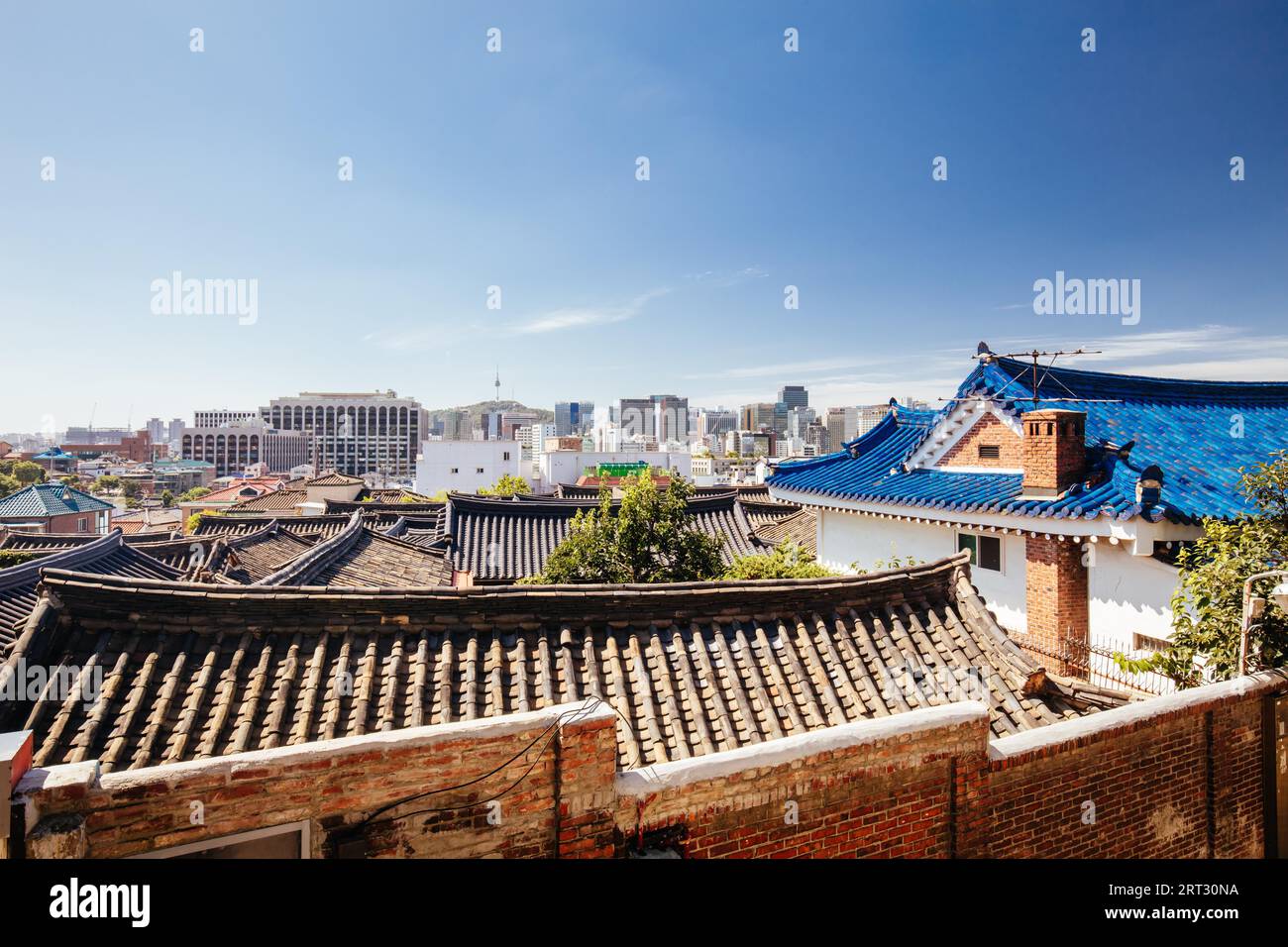 A view across rooftops in Bukchon Hanok Village. This area is a Korean ...