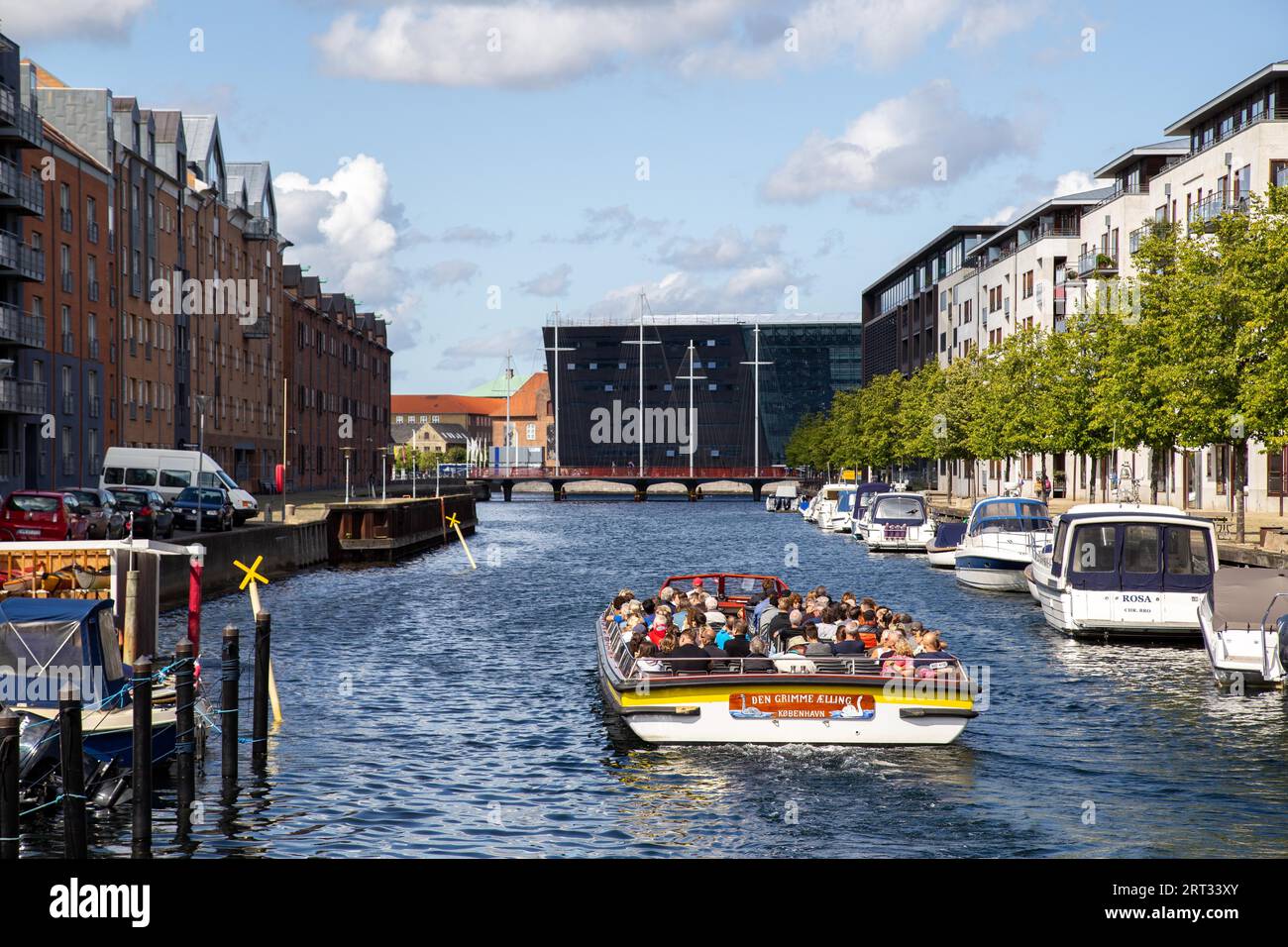 Copenhagen, Denmark, August 21, 2019: Tourist boat in a canal in Christianshavn district Stock Photo