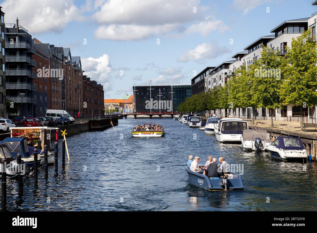 Copenhagen, Denmark, August 21, 2019: Tourist boat in a canal in Christianshavn district Stock Photo