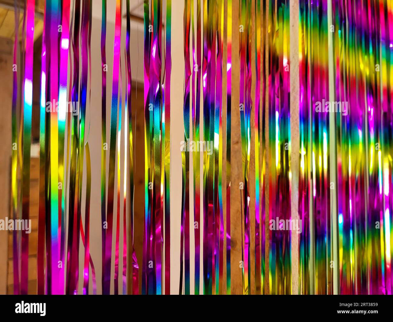 Festive multicolored Rainbow shiny beautiful Christmas New Year Tinsel garland. Texture. Background. Stock Photo