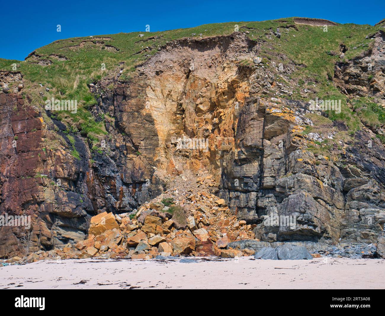 Lewis Rocks Rock strata are visible above rock debris after a coastal land slip on ...