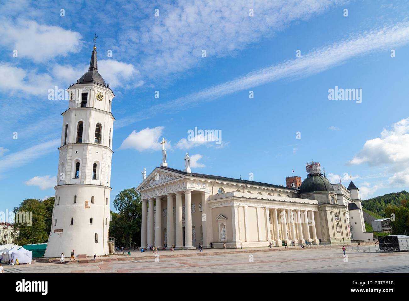 Bell Tower of Vilnius Cathedral and Vilnius Cathedral during the day. Stock Photo