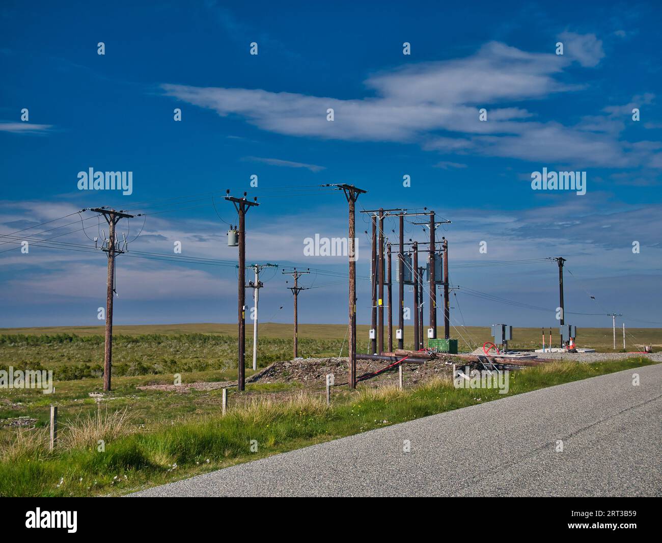 Electricity supply and distribution poles and infrastructure on the Isle of Lewis in the Outer Hebrides in Scotland, UK. Stock Photo